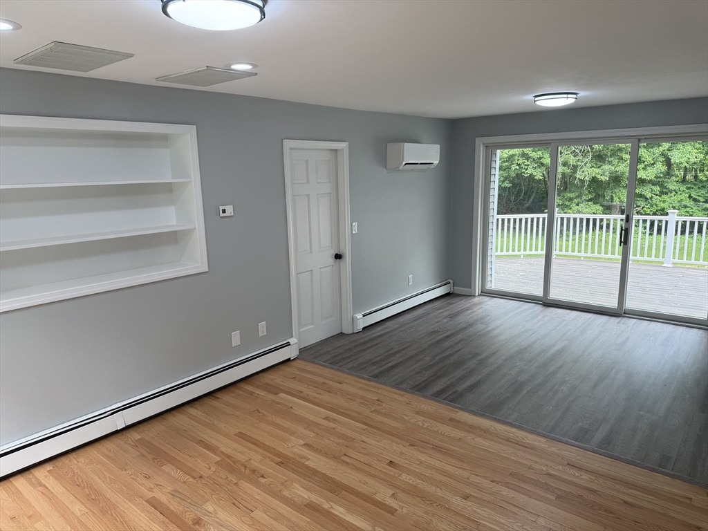295 Frenchtown Road East Greenwich, RI 02818 - Photo 5 of 26 a view of empty room with wooden floor and fan