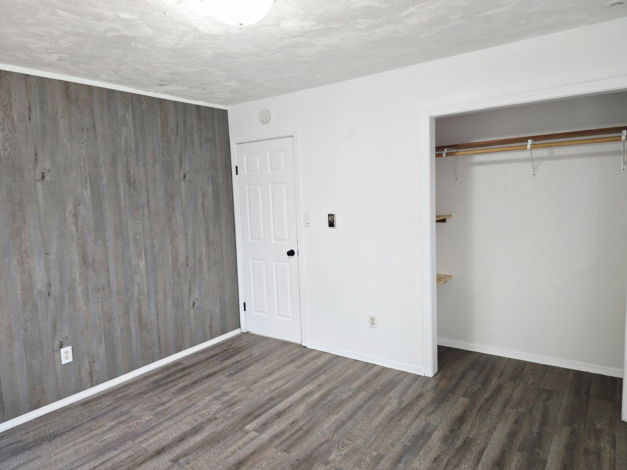 11535 Sandhill Trail Demotte, IN 46310 - Photo 21 of 31 a view of an empty room with wooden floor