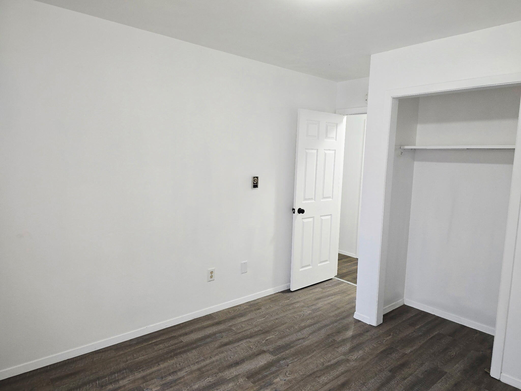 11535 Sandhill Trail Demotte, IN 46310 - Photo 23 of 31 a view of an empty room with wooden floor