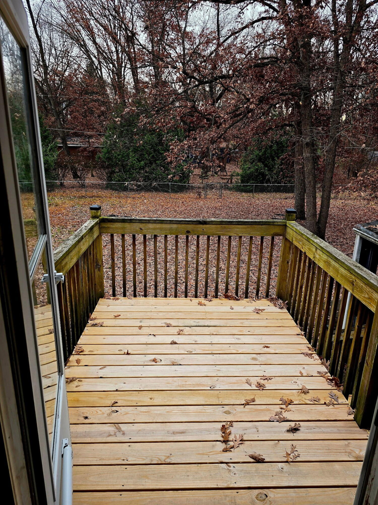 11535 Sandhill Trail Demotte, IN 46310 - Photo 26 of 31 a view of balcony with wooden floor and fence