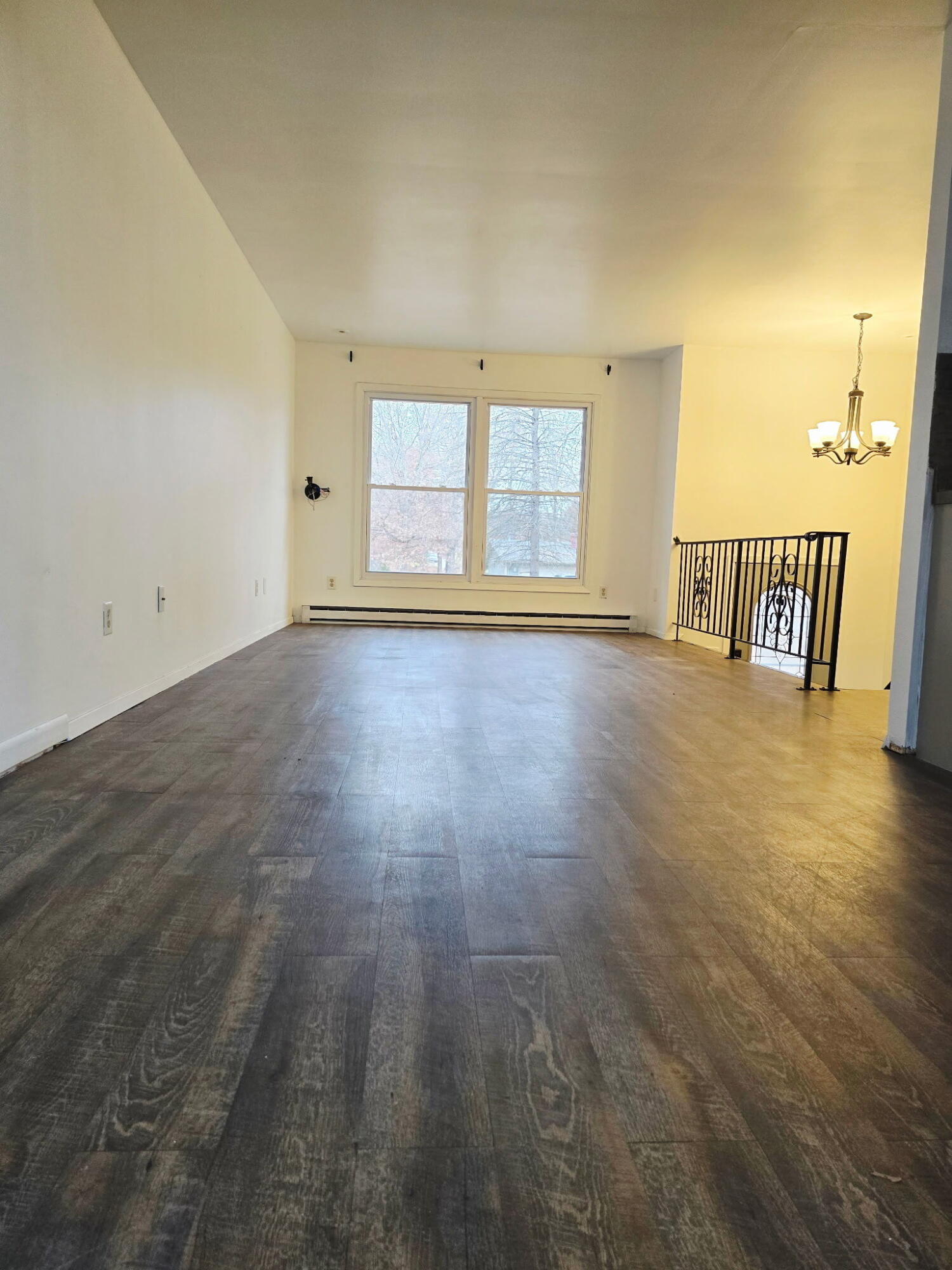 11535 Sandhill Trail Demotte, IN 46310 - Photo 7 of 31 an empty room with wooden floor and windows