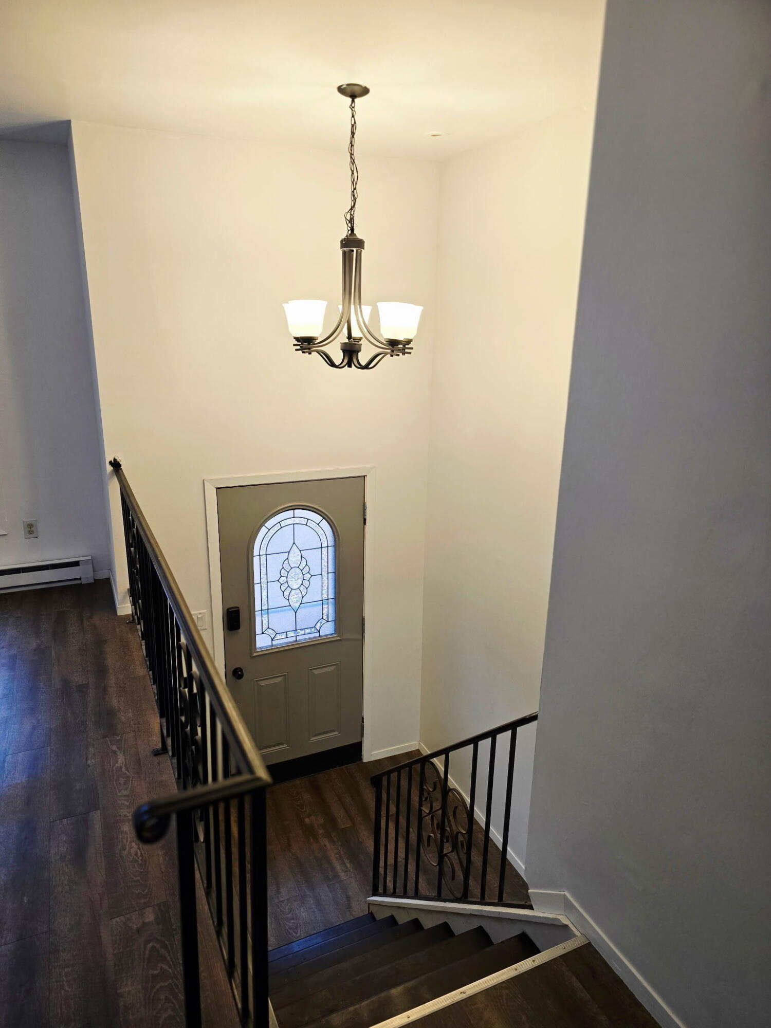 11535 Sandhill Trail Demotte, IN 46310 - Photo 9 of 31 a view of a hallway with wooden floor and stairs