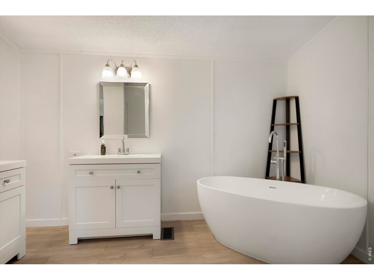 8451 Madison Way Denver, CO 80229 - Photo 12 of 27 5-Piece Primary Bath with Free Standing Soaker Tub, Shower and Two Vanities