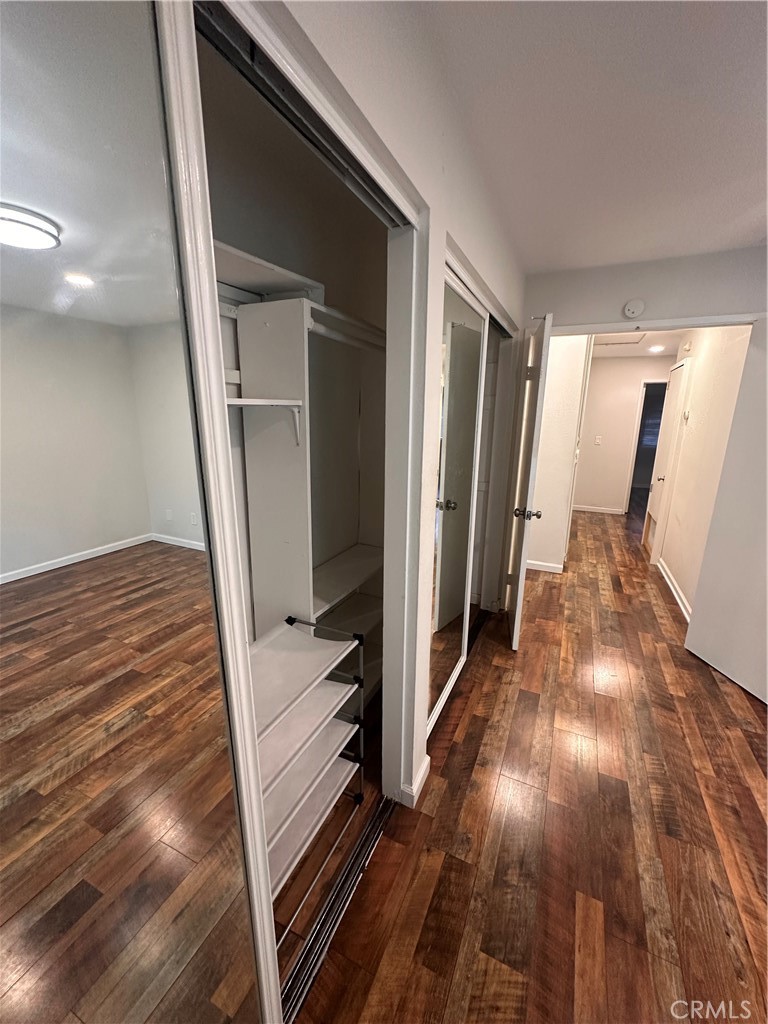 1440 North Weeping Willow Lane Anaheim, CA 92801 - Photo 10 of 31 a view of a hallway view with wooden floor and staircase