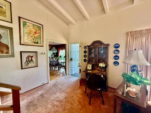 a kitchen with a table and chairs in it