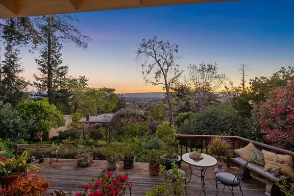 a view of a chairs and table in the patio
