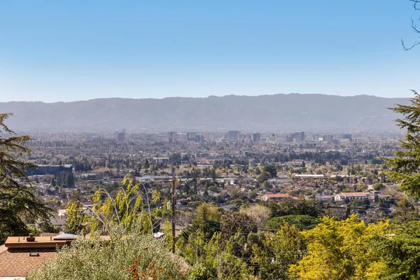 a view of a city with mountains in the background
