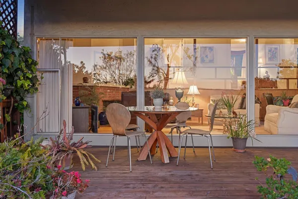 a view of a chairs and table in a patio