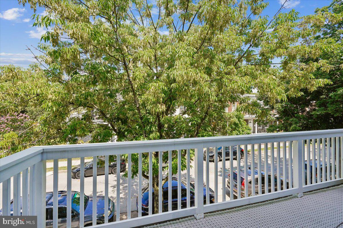 1203 Staples Street Northeast Washington, DC 20002 - Photo 19 of 51 Serene balcony view with lush greenery.