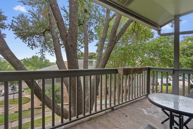a view of a two chairs in the balcony
