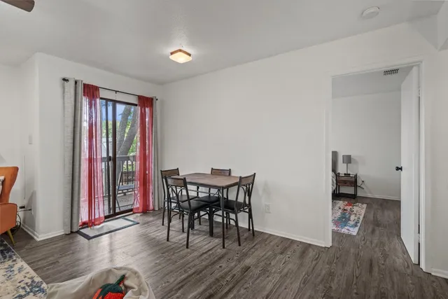 a workspace room with furniture and wooden floor