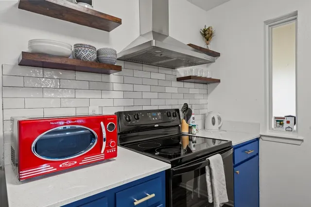 a kitchen with a stove and a sink