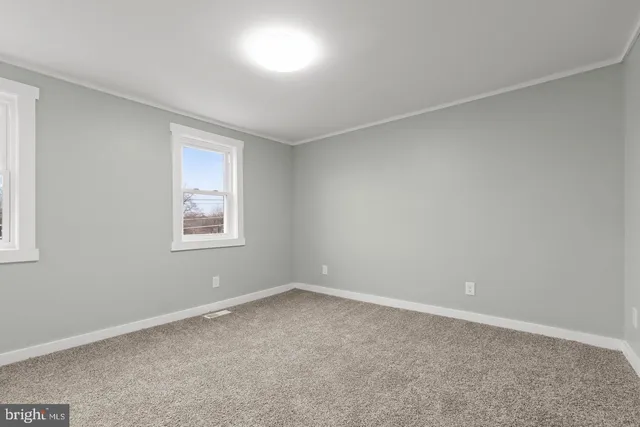 an empty room with windows