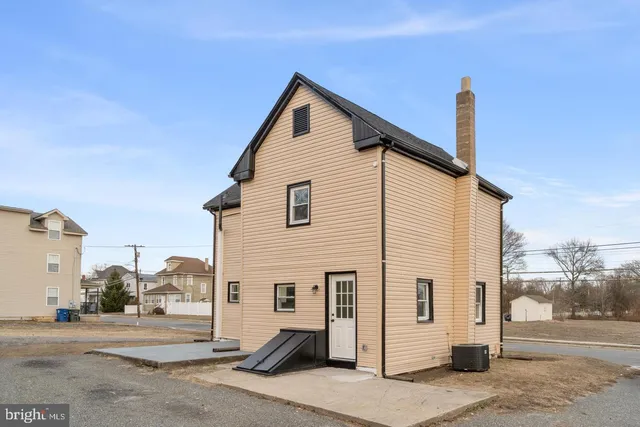 a view of a house with a street