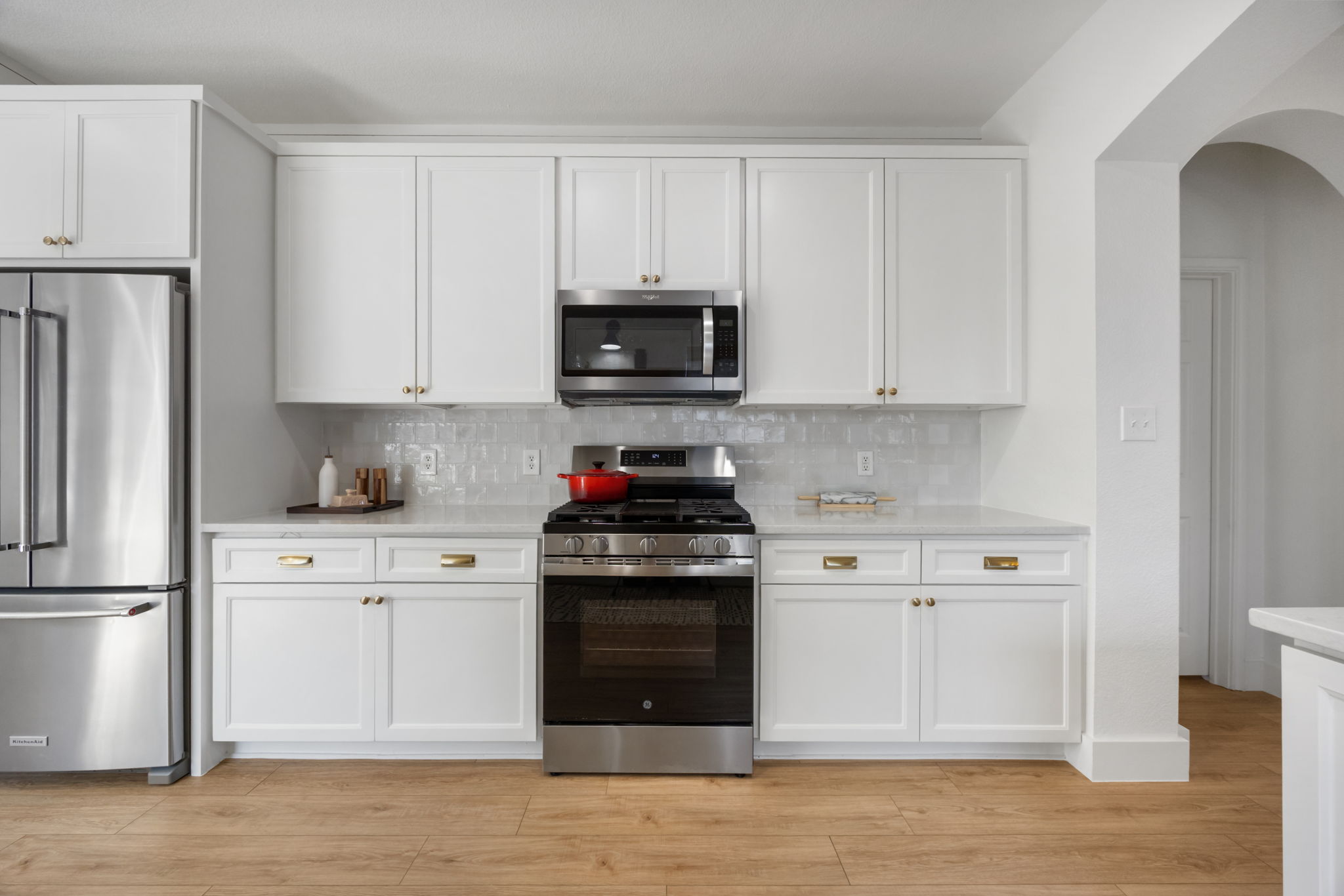 2510 Thornton Road Austin, TX 78704 - Photo 11 of 40 a kitchen with stainless steel appliances granite countertop a stove a refrigerator and a microwave