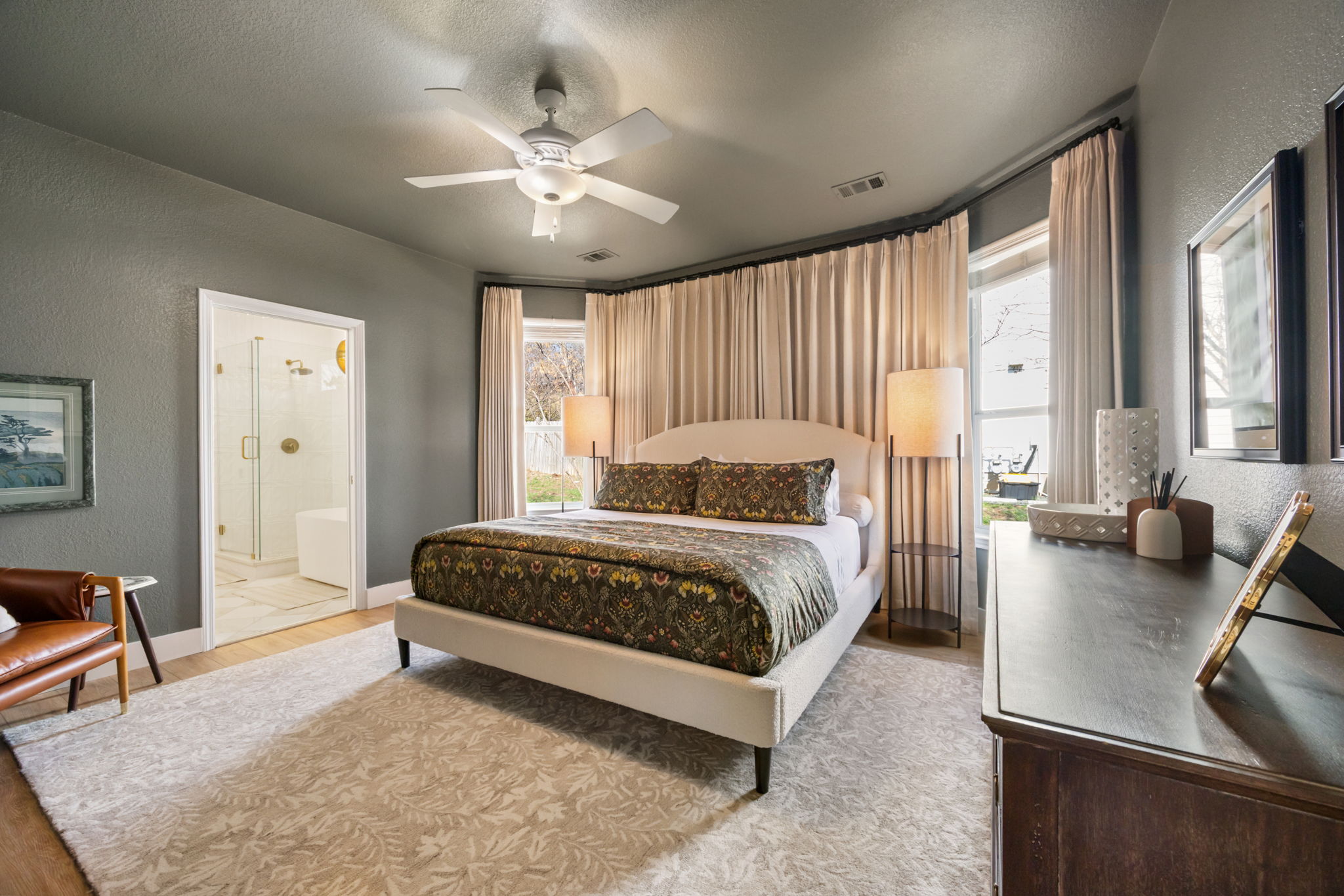 2510 Thornton Road Austin, TX 78704 - Photo 14 of 40 a spacious bedroom with a large bed and a chandelier