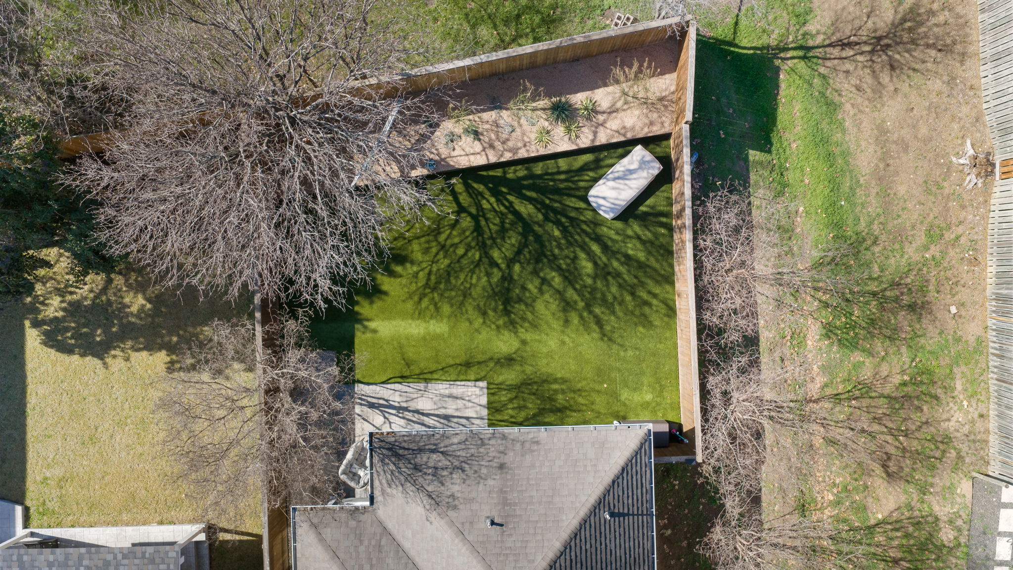 2510 Thornton Road Austin, TX 78704 - Photo 39 of 40 a partial view of a brick house with a tree in front of it