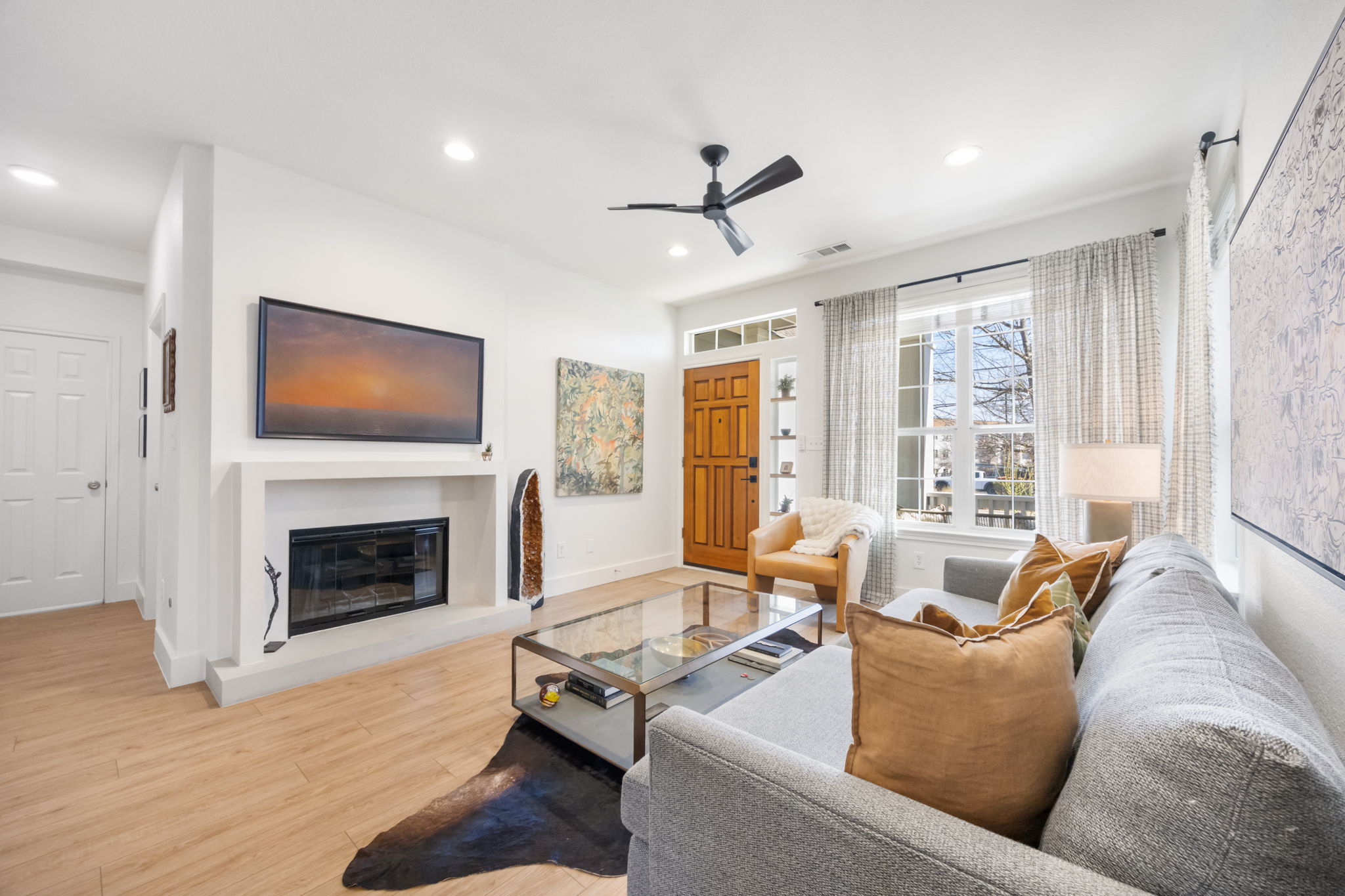 2510 Thornton Road Austin, TX 78704 - Photo 4 of 40 a living room with furniture fireplace and large windows
