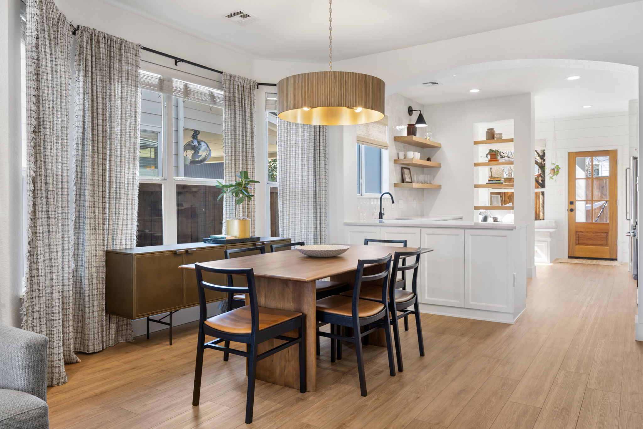 2510 Thornton Road Austin, TX 78704 - Photo 40 of 40 a dining room with furniture a chandelier and wooden floor
