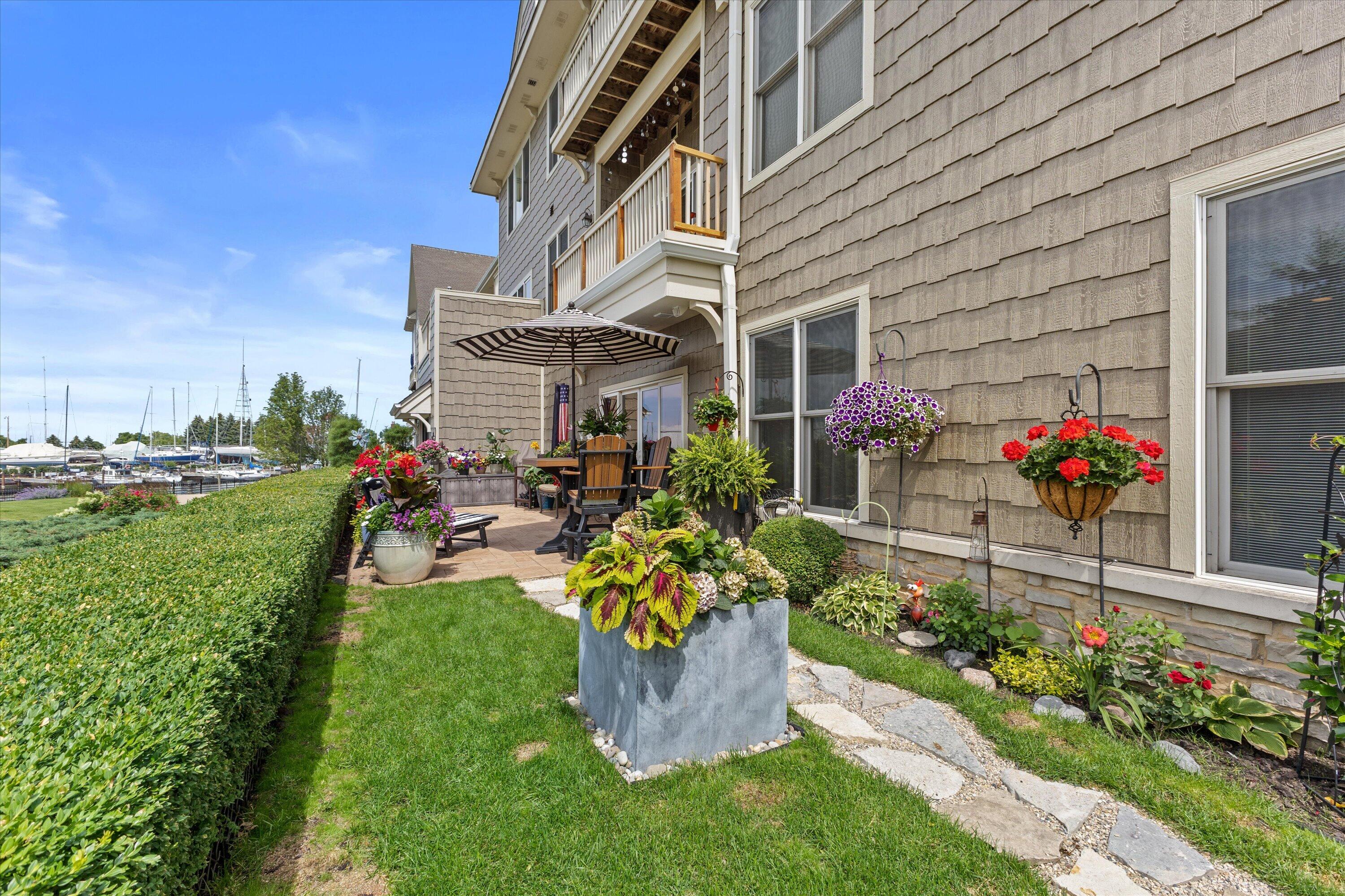 4 Gas Light Drive, Unit 111 Racine, WI 53403 - Photo 27 of 31 Green Space and Patio
