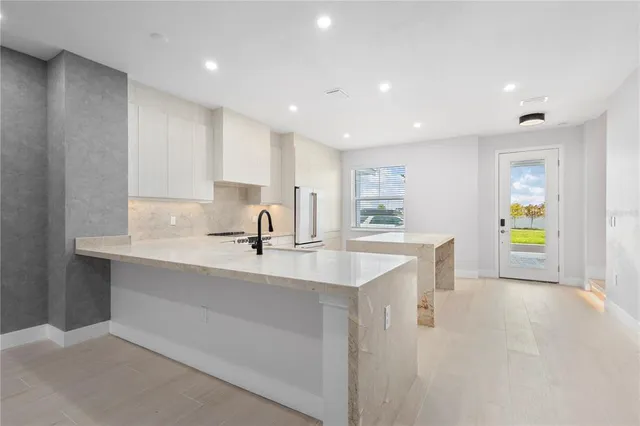 a kitchen with a sink cabinets and counter space