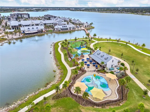 a view of a water with boats and trees in the background