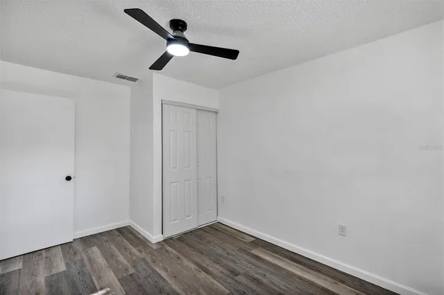 a view of room with a ceiling fan
