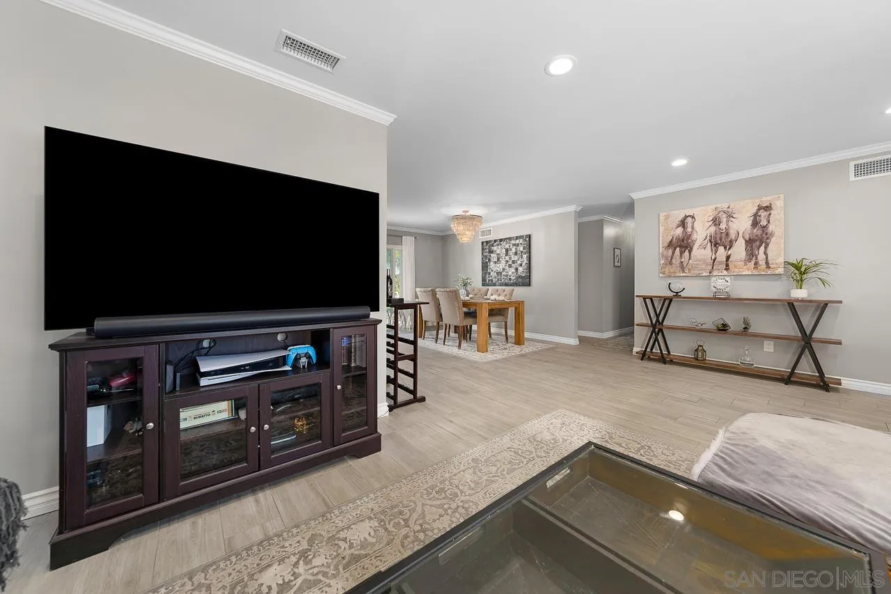 9311 Oakbourne Road Santee, CA 92071 - Photo 11 of 64 a living room with furniture and a flat screen tv