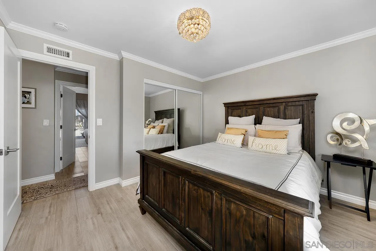 9311 Oakbourne Road Santee, CA 92071 - Photo 23 of 64 a bedroom with a bed and a table