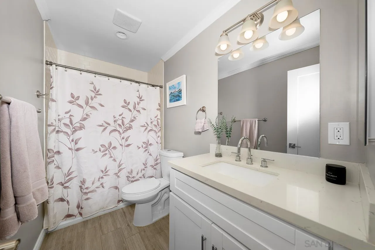 9311 Oakbourne Road Santee, CA 92071 - Photo 26 of 64 a bathroom with a sink a toilet and shower