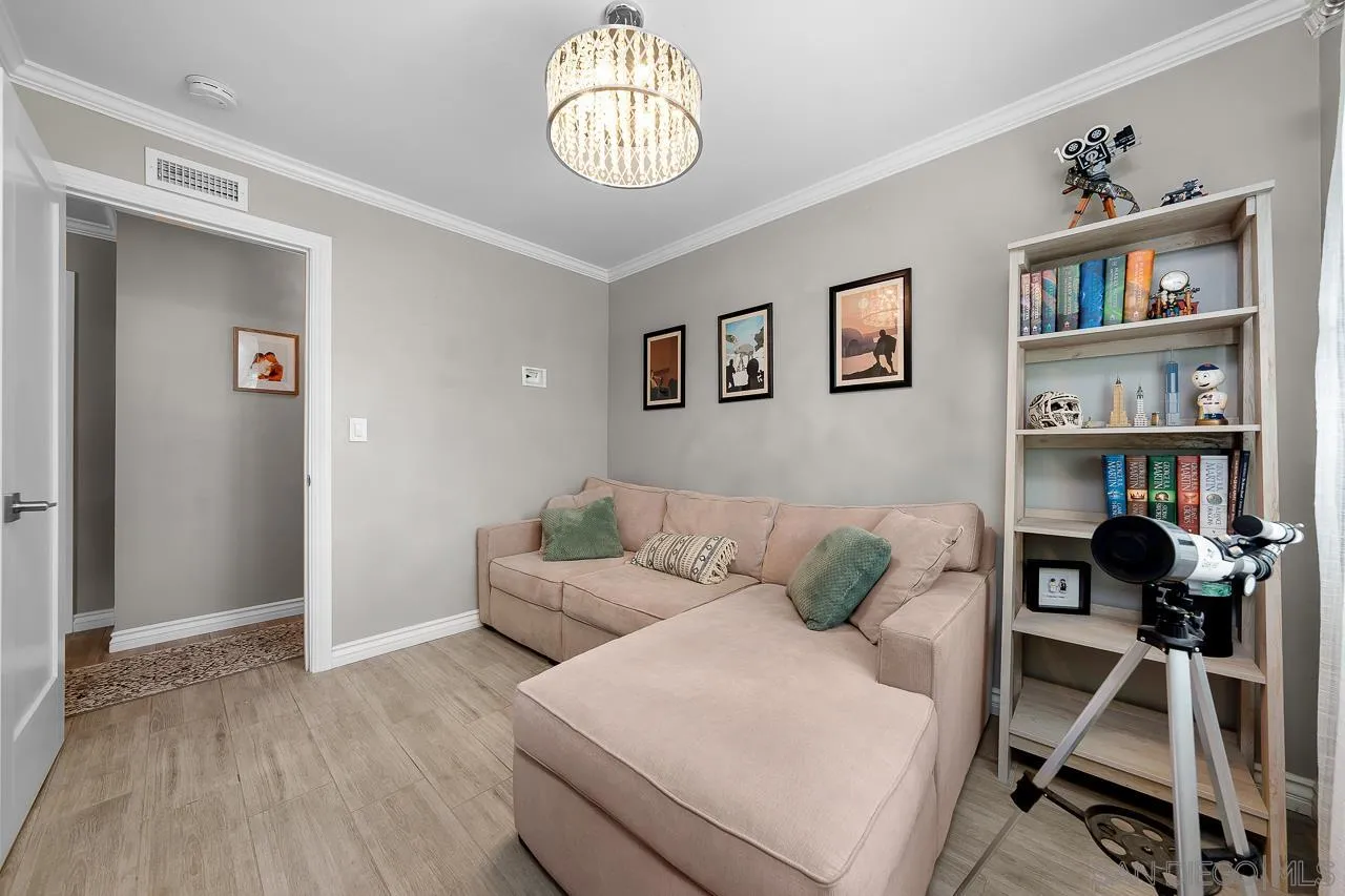 9311 Oakbourne Road Santee, CA 92071 - Photo 27 of 64 a living room with furniture and a book shelf
