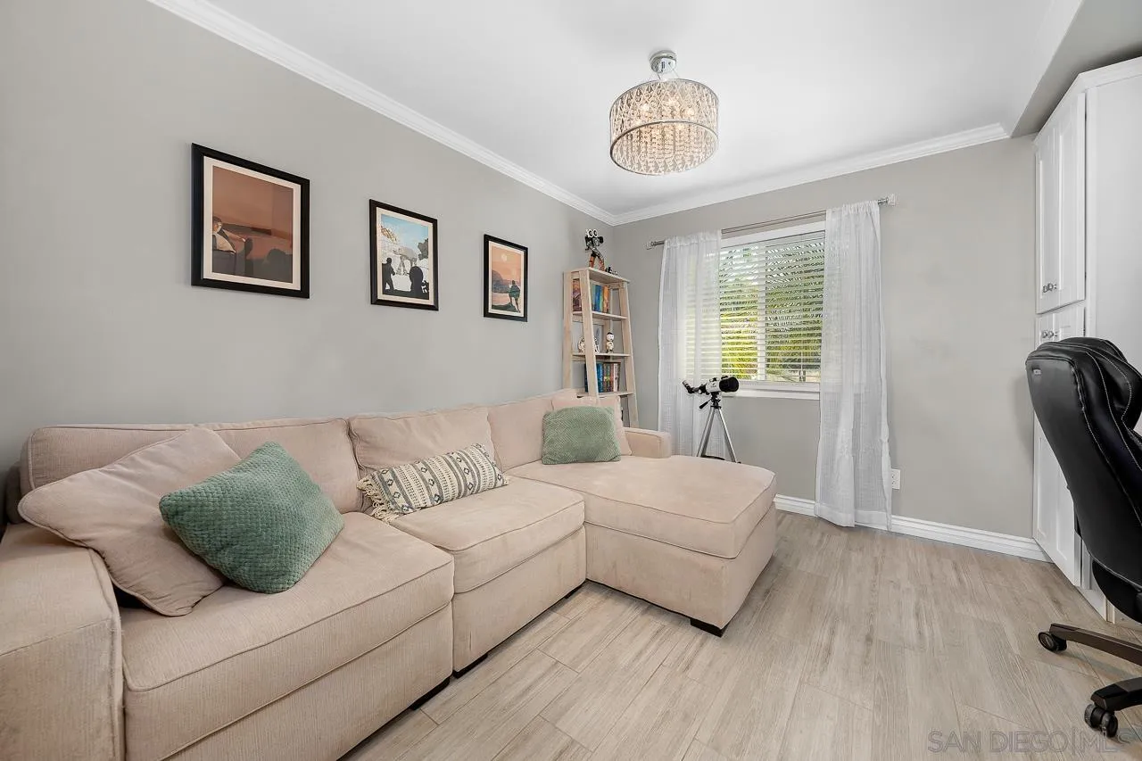9311 Oakbourne Road Santee, CA 92071 - Photo 28 of 64 a living room with furniture and a flat screen tv
