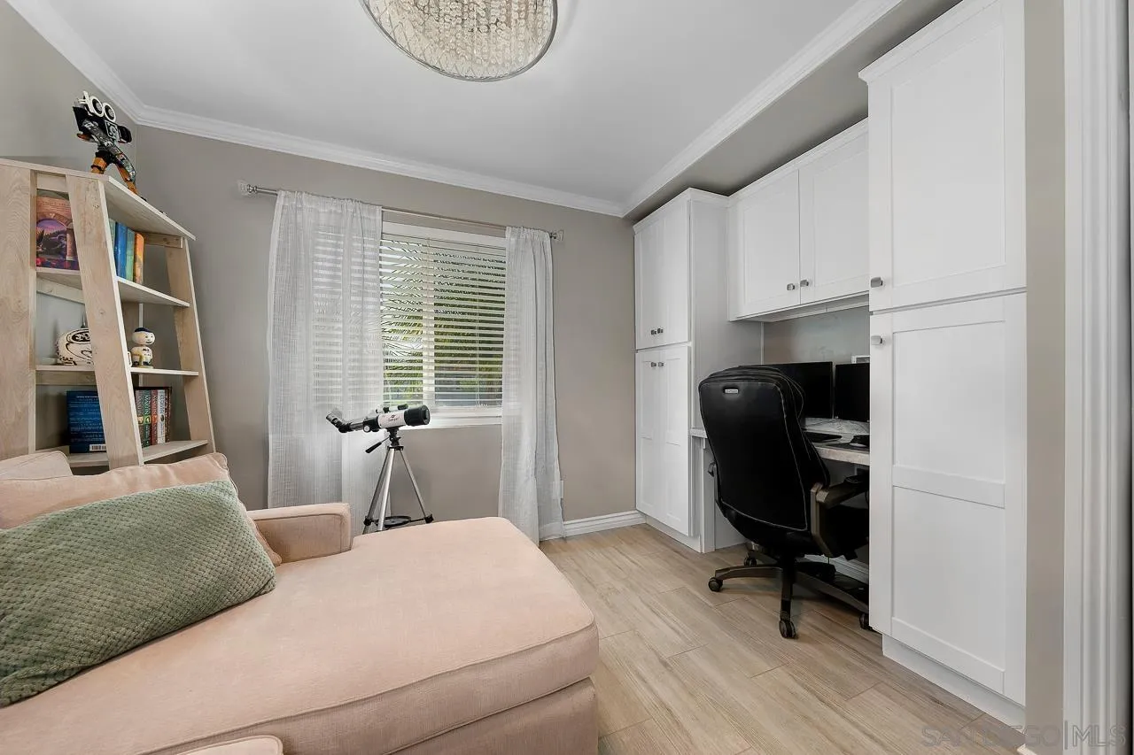 9311 Oakbourne Road Santee, CA 92071 - Photo 29 of 64 a bedroom with a bed and a chair