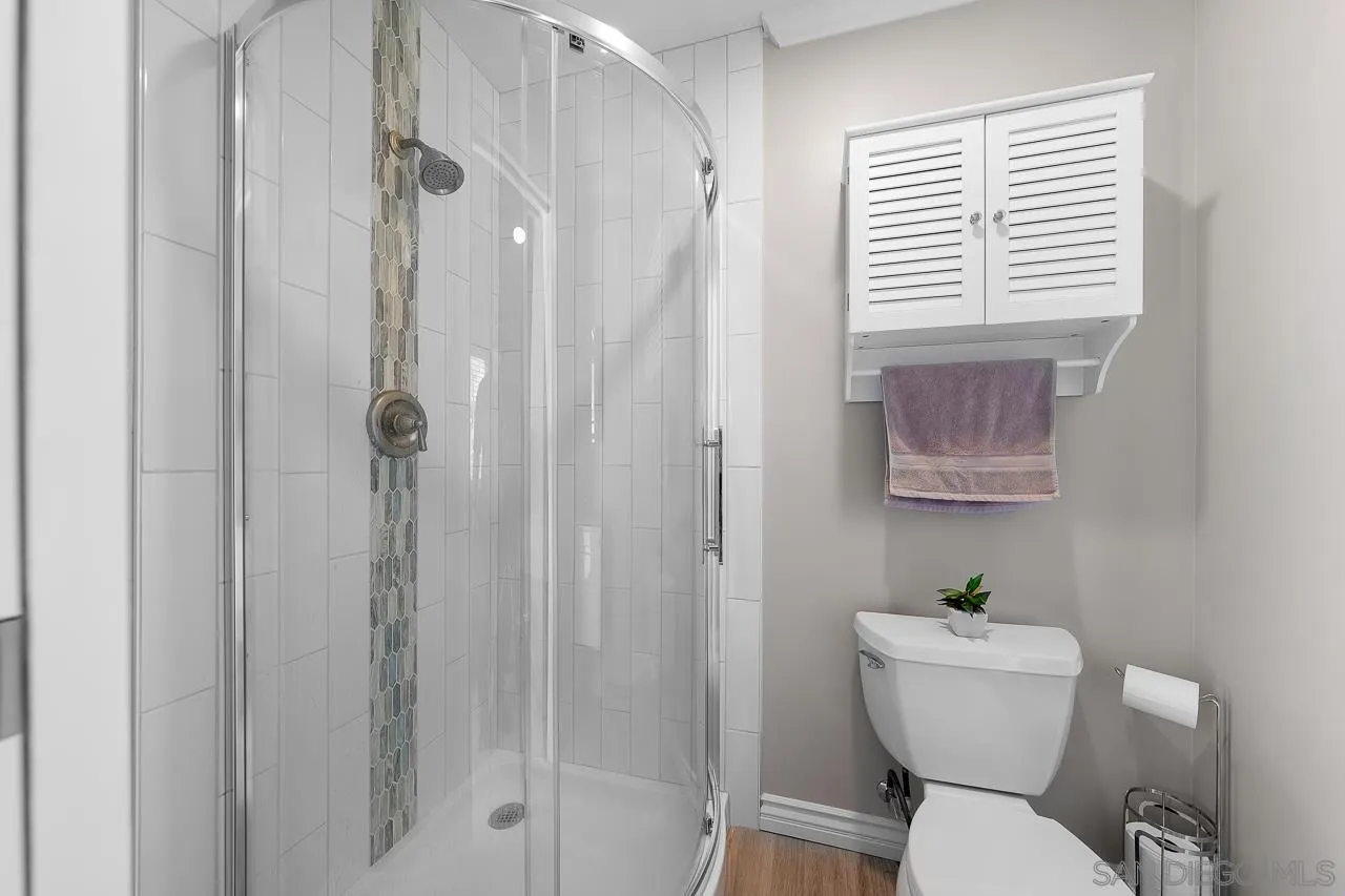 9311 Oakbourne Road Santee, CA 92071 - Photo 33 of 64 a bathroom with a toilet a sink and shower