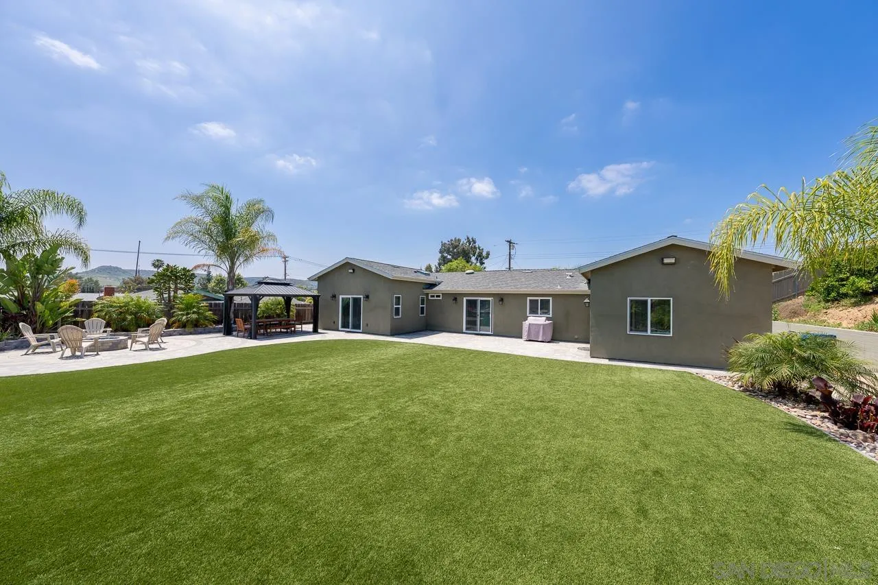 9311 Oakbourne Road Santee, CA 92071 - Photo 37 of 64 a front view of house with yard and trees