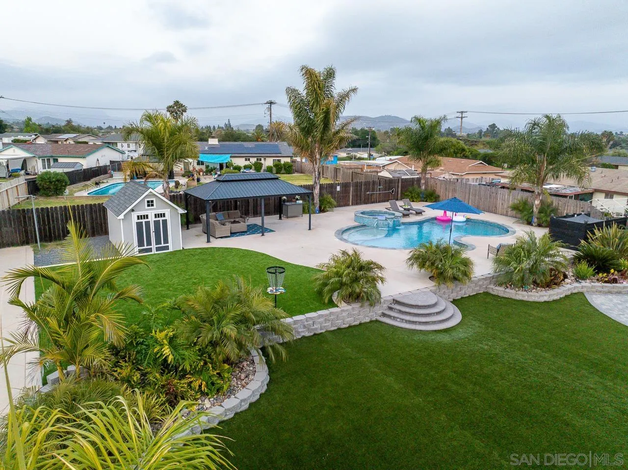 9311 Oakbourne Road Santee, CA 92071 - Photo 38 of 64 a view of a garden with lawn chairs