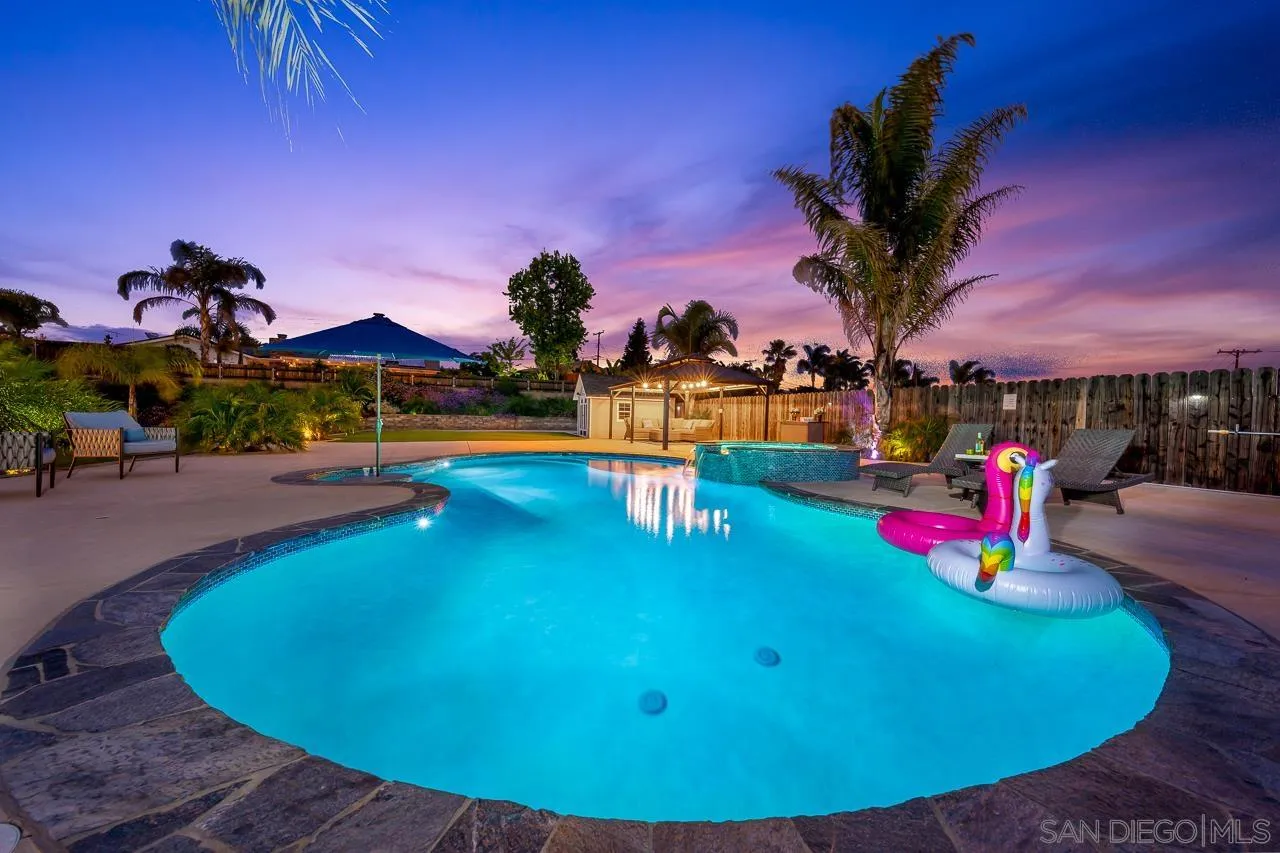 9311 Oakbourne Road Santee, CA 92071 - Photo 52 of 64 a view of a swimming pool with an outdoor space and seating area