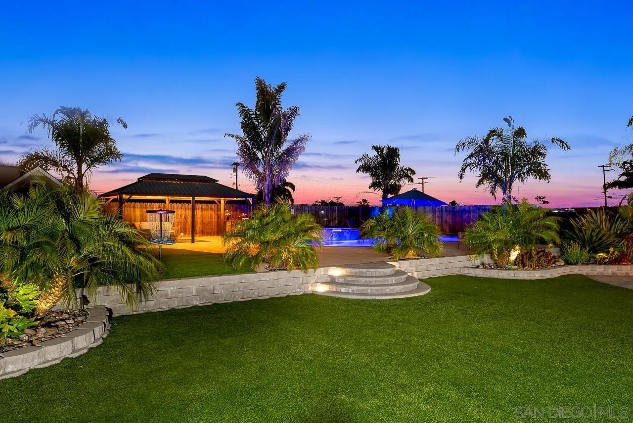 9311 Oakbourne Road Santee, CA 92071 - Photo 55 of 64 a view of a house with a yard and palm trees