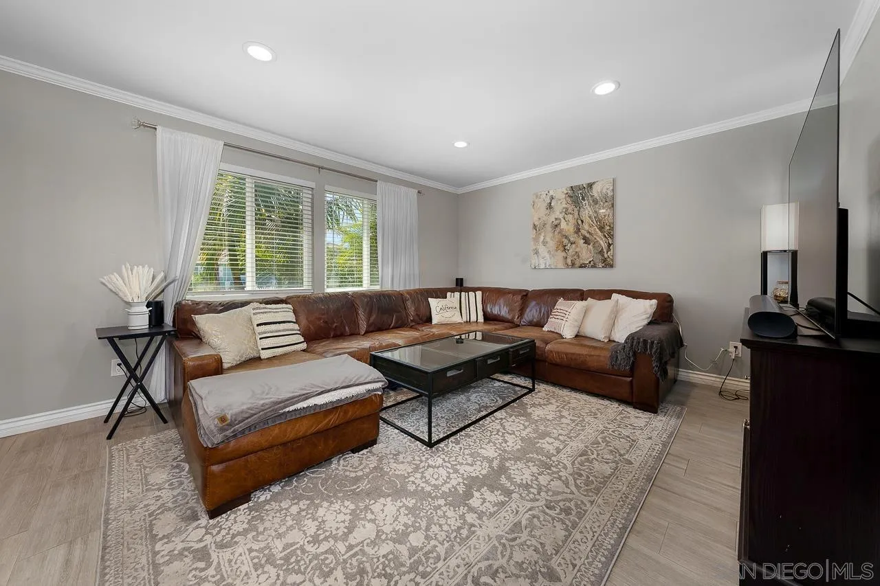 9311 Oakbourne Road Santee, CA 92071 - Photo 10 of 64 a living room with furniture and a flat screen tv