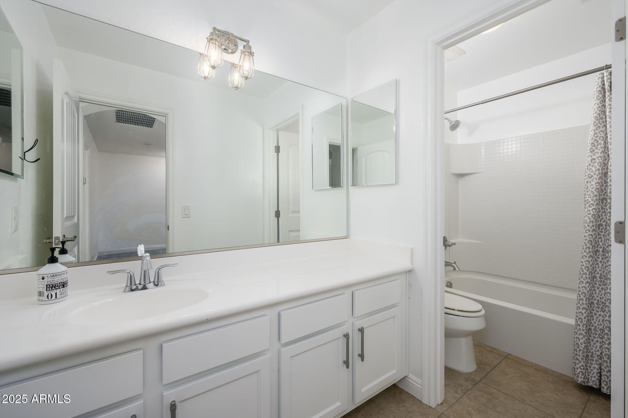 20563 West White Rock Road Buckeye, AZ 85396 - Photo 11 of 17 a bathroom with a double vanity sink toilet mirror and shower