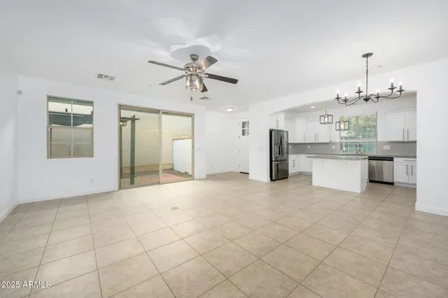 a view of a kitchen with a sink and cabinets
