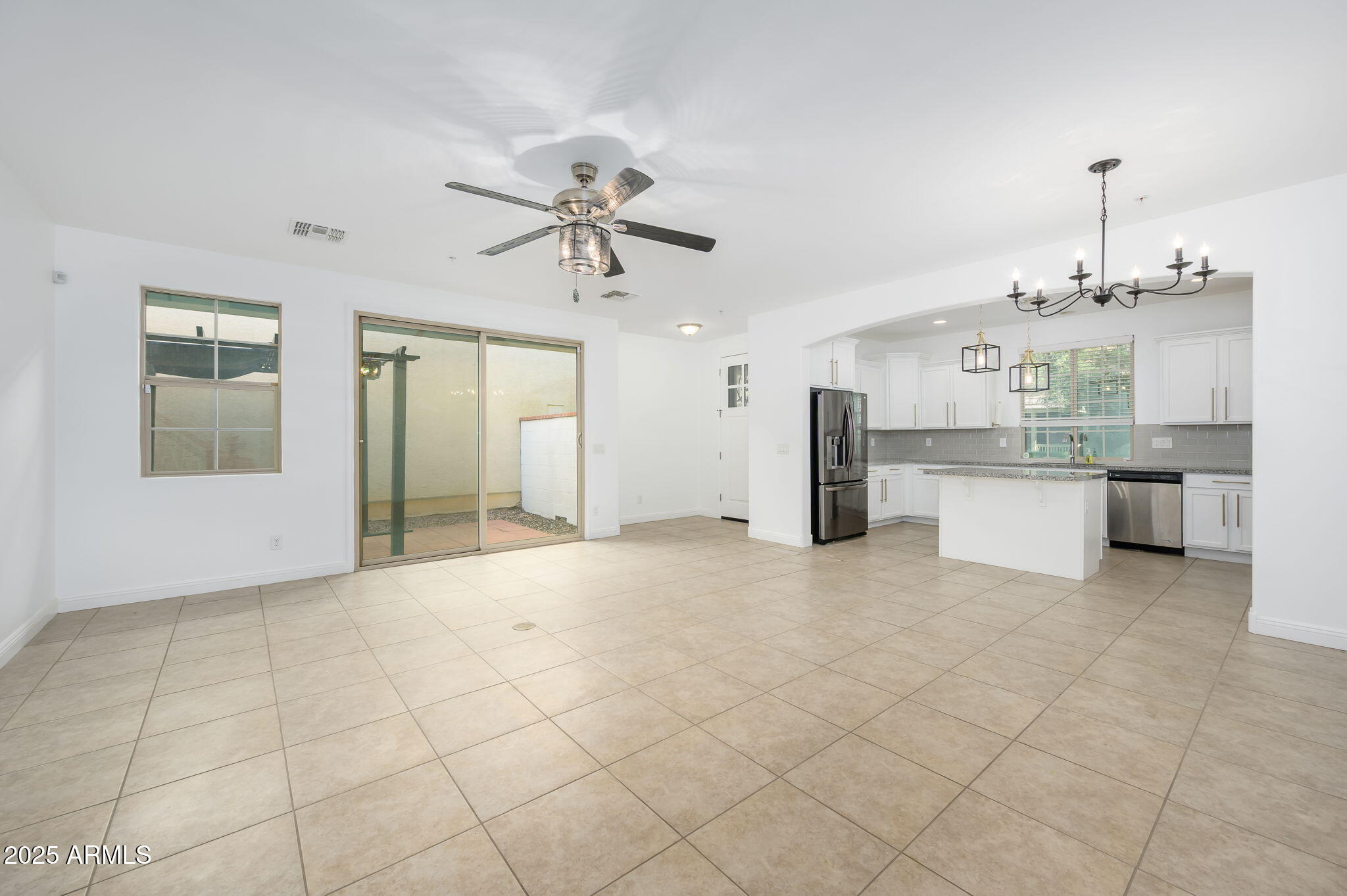 20563 West White Rock Road Buckeye, AZ 85396 - Photo 3 of 17 a view of a kitchen with a sink and cabinets