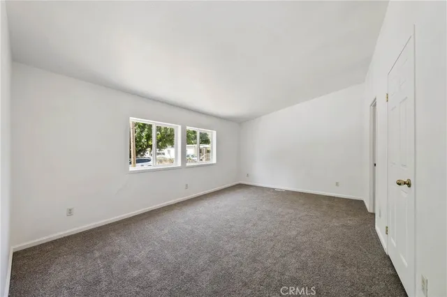 a view of an empty room and entryway