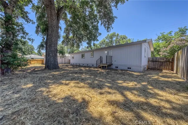 a backyard of a house with lots of green space