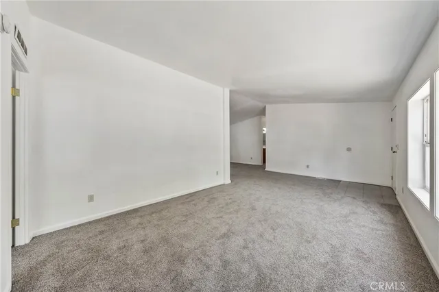 a kitchen with granite countertop white cabinets and a sink
