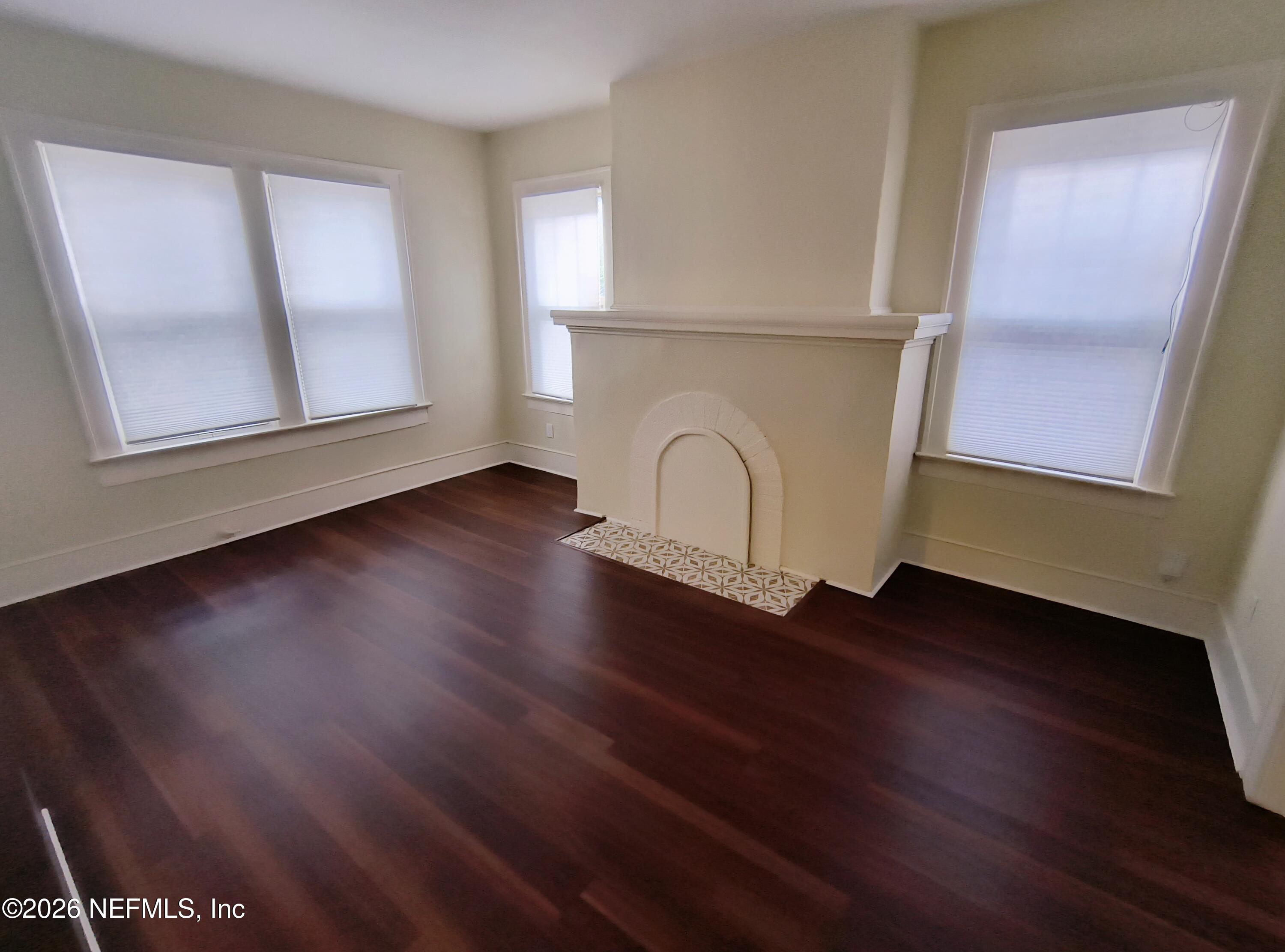 3577 Valencia Road, Unit 1 Jacksonville, FL 32205 - Photo 5 of 17 a view of a room with wooden floors and cabinet