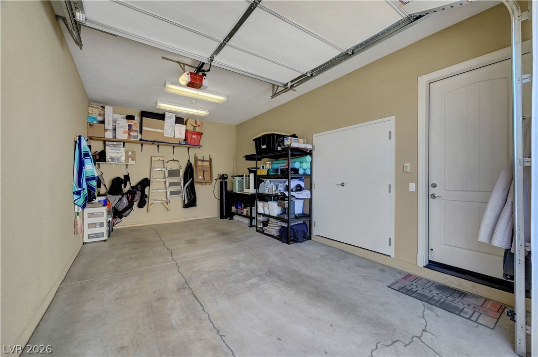 10 Strada Bella Vista, Unit 101 Henderson, NV 89011 - Photo 35 of 64 Garage with a garage door opener, entry to house.