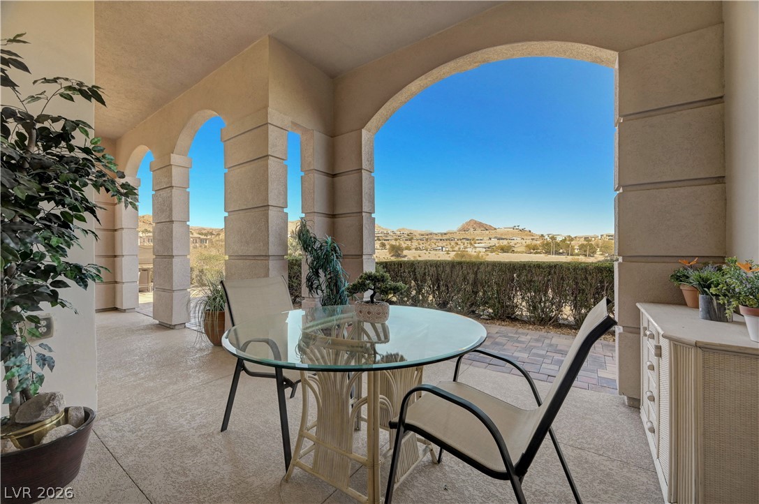 10 Strada Bella Vista, Unit 101 Henderson, NV 89011 - Photo 37 of 64 View of patio / terrace featuring outdoor dining space