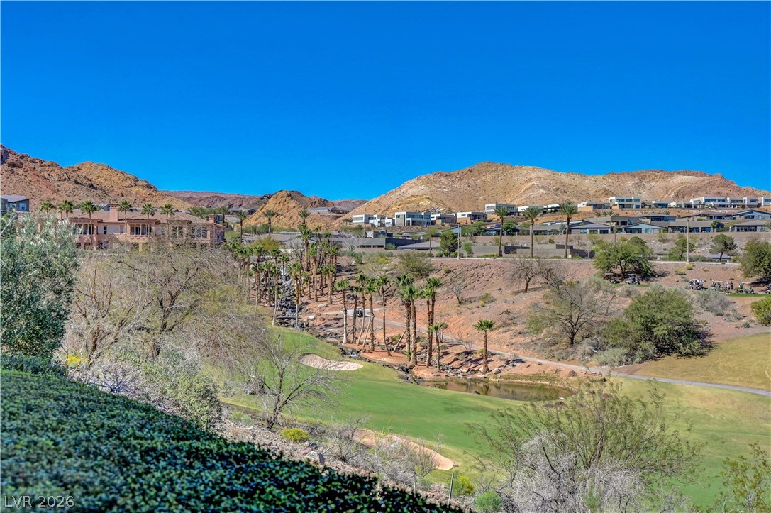 10 Strada Bella Vista, Unit 101 Henderson, NV 89011 - Photo 52 of 64 Mountain view featuring a waterfall and a local golf course