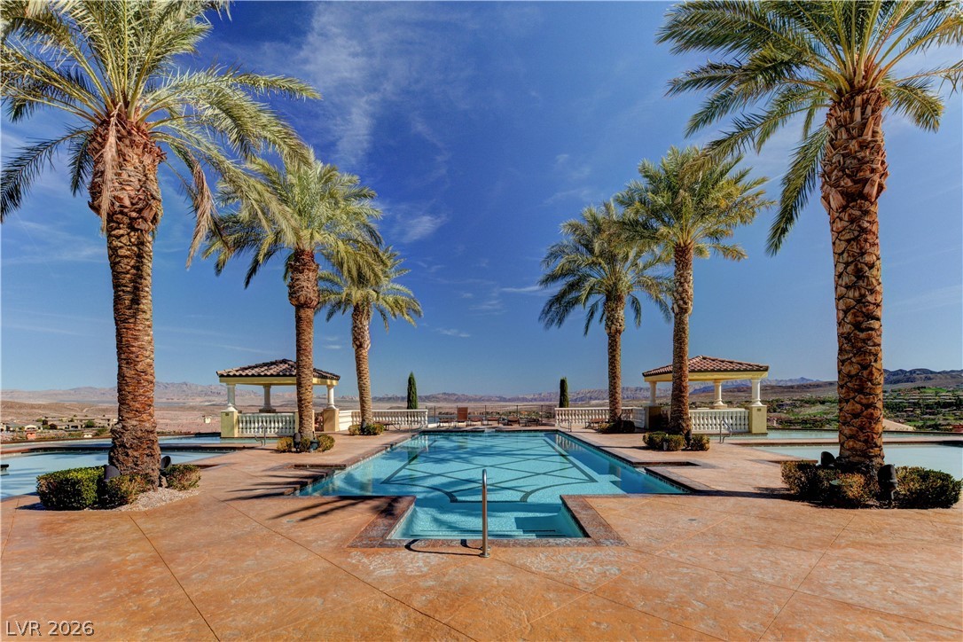 10 Strada Bella Vista, Unit 101 Henderson, NV 89011 - Photo 57 of 64 The pool featuring a gazebo, a mountain view